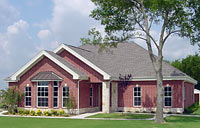 House with steel frame, brick walls, and shingle roof